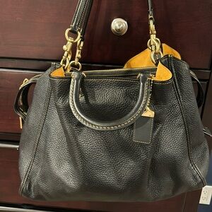 Coach Carryall in black pebble leather.